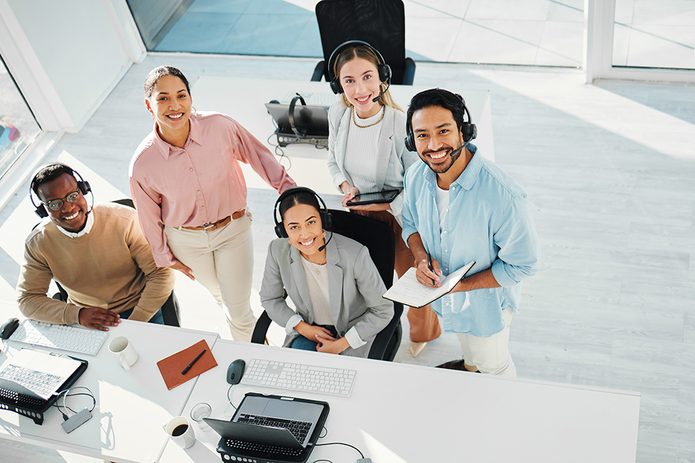 Happy telemarketing team, portrait and group in call center for customer service, IT support or col.